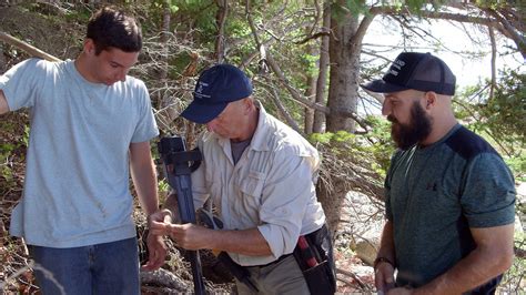 The two divers were joined by Jack Begley and Peter Fornetti, who kept an eye on things from the boat. ... In the meantime, Oak Island historian Doug Crowell discovered an intriguing on-land rock .... 