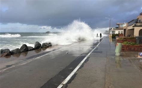As king tides surged and gusty winds blew Thursday mor