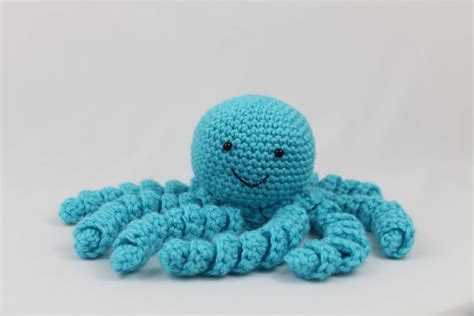 Octopus crochet. Make sure that the face part is facing up. I lightly stuffed the animal with some filling material. The tentacles are made with slipstitches. All parts are crocheted with a 3.5 mm crochet hook. For a small octopus use a 3 mm crochet hook. Finished size: Big one (pink)13 cm (with tentacles) Small one (blue) 11 cm. 