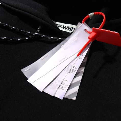 Off white tag. Off-White seemingly settled the issue back in 2017, when it released an instructional video on what to do with the tags. Despite the clear instructions to “cut the tie” and “leave it alone ... 