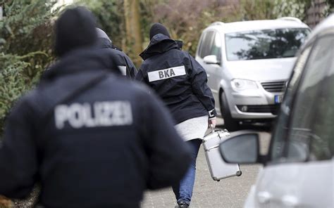 Officer shot during German police raids tied to extremists