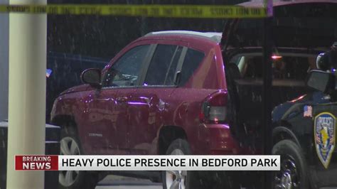 Officer shot during struggle with carjacking suspect in Bedford Park