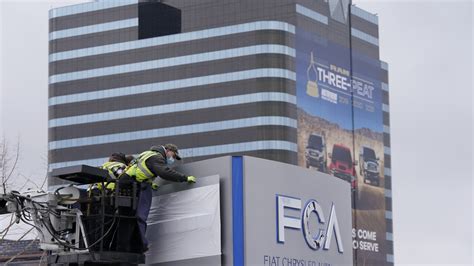 Official at automaker FCA US pleads guilty in scheme to withhold emission systems information