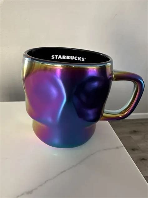 Unique Oil Slick Studded Tumbler!! This listing is for one 24 oz double wall Tumbler. ‼️Please note that this tumbler is NOT STARBUCKS BRAND.‼️ These tumblers are exactly like the Starbucks brand tumblers with the exception of the logo missing in the middle of the cup. I have customized them with the “Skull Starbucks Logo”.. 