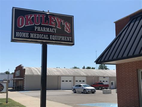 About Okuley's Pharmacy. Okuley’s Pharmacy has been a family owned business since 1950. Blaine Okuley originally purchased the drug store from the McDowell family. After a store fire on New Year’s Eve 1969, the store underwent major reconstruction and a pharmacy was added in 1971.. 