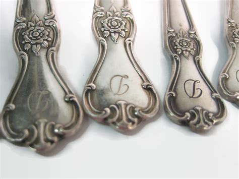 This is a beautiful set of 45 pieces of Old Company plate Signature Rose silverplate flatware. The set includes all you need for a large family or dinner party. Each piece is adorned with the Signature Rose pattern and a mono "P". This traditional style set is post-1940 and in excellent condition.. 