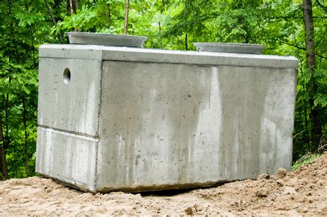 Concrete Concrete septic tanks cost $700 to $2,000 for the tank alone