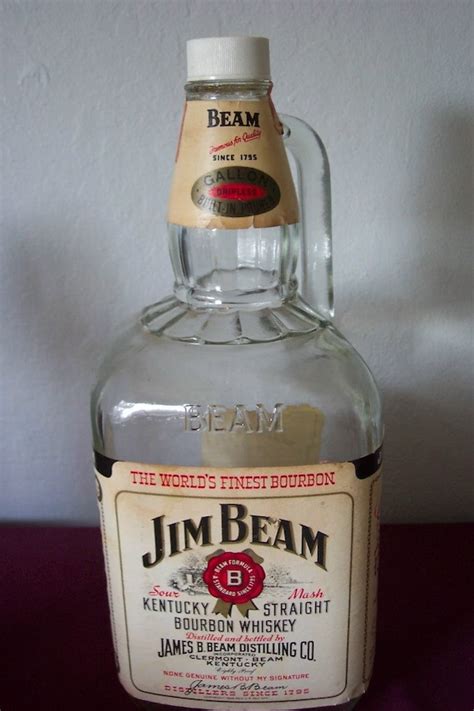 An empty Jim Beam Whiskey bottle with Red Fox. An empty Jim Beam Whisk