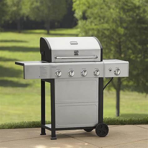 6-burner gas grill features stainless steel grates for added durability. Side simmer burner is great for sauces. Rear ceramic rotisserie burner enhances the appeal of this gas grill. Slide-out grease tray makes cleanup easy. Side shelf offers you enough space to place your food items. Electronic ignition system ensures easy start.. 