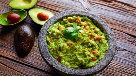 Ole guacamole. Directions. Cut avocados into halves. Remove seeds and scoop out the pulp into a small bowl. Use a fork to mash the avocado. Stir in lemon juice, onion, olive oil, and salt. Cover the bowl and refrigerate for 1 hour before serving. I Made It. 