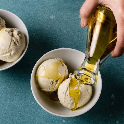 Olive oil on ice cream. Warm the milk, sugar, 1/2 cup of the cream, and salt in a medium saucepan. Purée banana in a blender or food processor (using some of the warm liquid if needed), then whisk into milk mixture. Scrape the seeds from the vanilla bean into the warm milk. Mixture should be warm and steaming but not boiling. Cover, remove from the heat, and let ... 