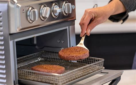 Omaha burgers in air fryer. To cook fresh beef burgers in an air fryer, preheat the air fryer to 375°F (190°C). Place the burger patties in the air fryer basket and cook for about 10 to 12 minutes, flipping halfway through. Ensure the internal temperature of the burgers reaches 160°F (71°C) for food safety. 