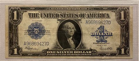 One dollar bill with blue seal. The 1935 D Dollar Bill, also known as the 1935D Silver Certificate, was produced by the United States Bureau of Engraving and Printing. It was issued as part of a series of silver certificates that were in circulation from 1928 to 1963. The ‘D’ in its name refers to the location where it was printed, which is Denver, Colorado. 
