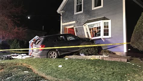 One person arrested after car crashes into house in Hopkinton