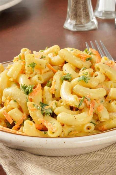 Ono hawaiian bbq macaroni salad recipe. Bring a large pot of salted water to a boil, then add dried pasta. Boil pasta 2 - 5 minutes longer than the package lists for al dente. Drain. Immediately add pasta to a large mixing bowl, add vinegar and stir until pasta absorbs the vinegar. Let sit 10-15 minutes. 