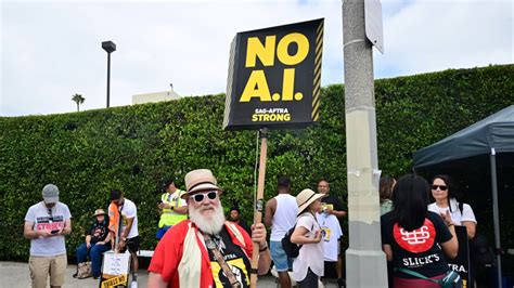 Optimism grows over possible agreement in Hollywood writers' strike but picketing continues