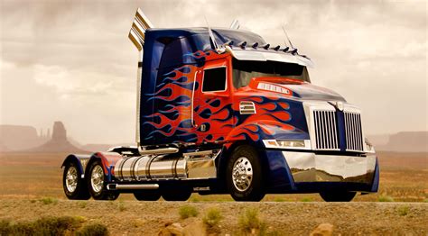 Optimus prime truck. For Transformers: Age of Extinction, Optimus Prime initially transforms into a rusty 1973 Marmon semi cab-over truck and later on a new alternate mode in a blue and red Western Star 5700 Custom ... 