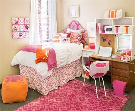Orange and pink dorm room. This gray and pink dorm room just looks so luxurious and cozy. There are so many different colors, patterns, and decorations that make it super interesting to look at. I love hanging huge tapestries in dorm rooms because they cover up a ton of blank wall space and are super affordable! 