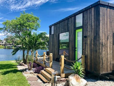 Orlando lakefront tiny home community. In the Orlando Lakefront Tiny House Community, there are 14 incredible tiny house vacation rentals, alongside many long-term rentals. The Venice, pictured below, is one of the short-term rentals that you can book for a stay. This modern tiny house design includes a cool garage door — with windows — that opens up to let in the indoors and ... 