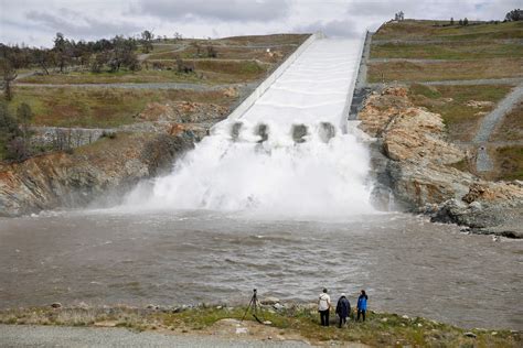Oroville Dam floodgates opening as storms fill massive reservoir