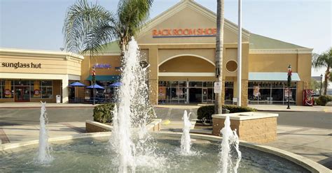 Tulare Outlets is an oasis of palms and flowing 