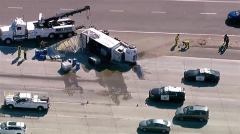 Overturned semi-truck carrying oil prompts lane closures on I-15