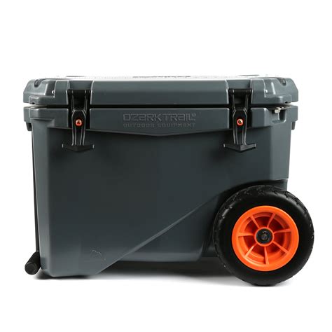 The Ozark Trail 45 Quart Rolling Cooler is a durable, lightweight cooler that is designed to keep your food and beverages cold for up to five days. It features two side handles, a lid handle, and four wheels for easy portability. The cooler also has an adjustable shoulder strap and an extra-large drain plug. The interior of the cooler is lined ... . 