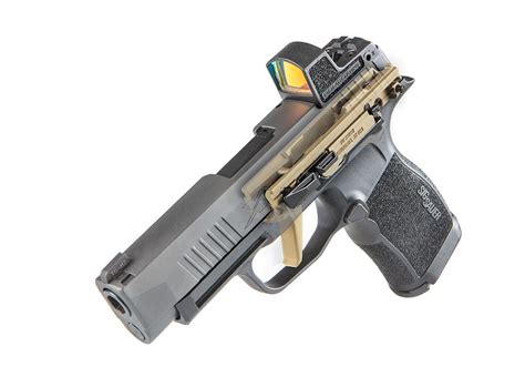 The P365 FCU Gold from Sig Sauer's Custom Works brings a distinctive appearance to your custom firearm. Its titanium frame ensures a strong foundation, fitting perfectly with Sig P365 parts. The flat face trigger, combined with the golden nitride coating, adds both performance and style to your build. As with the standard FCU, it ensures ...