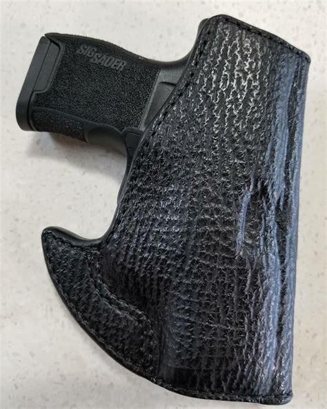 P365 pocket holster. Front Pocket Holster. Outside mostly flat to conceal better than other pocket holsters. Rides low in pocket (important for today’s larger pocket guns) Side thumb release for clean draw. 100% trigger coverage. Hand made in the USA with lifetime warranty. 