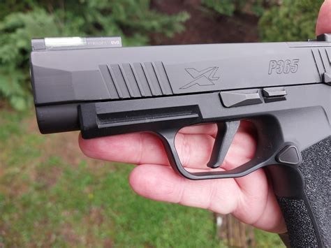 P365 trigger.  The flat trigger design gives shooters a lower position on the trigger...