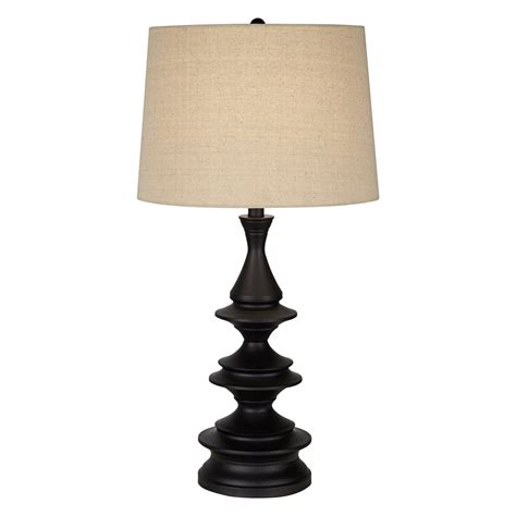 Riley modern table lamp by Pacific Coast Lighting. Brighten a living room space or use as bedroom lighting on a side table. Open base with segmented rings in a silver leaf finish. Metal construction. Black marble pedestal accent at the very bottom. Rectangular lamp shade in a white fabric with white top and bottom trim. 8-foot long cord.. 