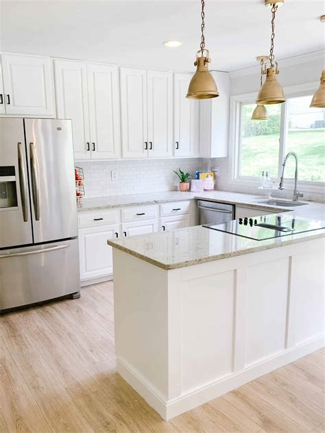 Paint cabinets white. Our maple builder grade cabinets went creamy white and gorgeous gray. I have been wanting to paint our kitchen cabinets white since we moved in 6 years ago. So ... 