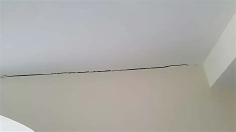 Paint cracking on coving.  Read this to learn why you have ceiling cracks...