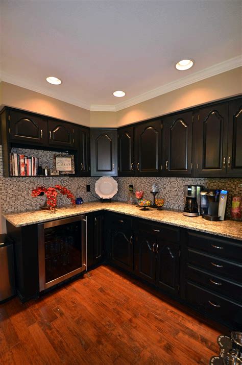 Painting kitchen cabinets black. Diminishes Size of Space. Without proper lighting, the dark color can have the effect of making the room smaller. Black absorbs light rather than reflecting it, which can result in a visual reduction of the light of the room and creates the illusion of a smaller space. The dark color also has a greater visual weight than lighter colors. 