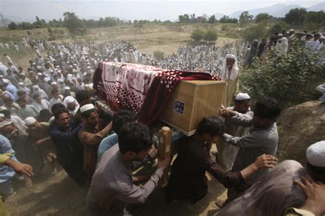 Pakistan buries dead from massive suicide attack at political rally that killed 54