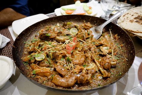 Pakistan cuisine. Add the tomatoes, coriander, cumin, red chili pepper, and remaining salt and sauté for another minute. Lower the heat to medium, cover, and allow the chicken cook for 20 minutes, stirring once in between. Uncover and raise the heat to high. Sauté for 10 minutes to finish cooking the chicken and reduce excess liquid.*. 