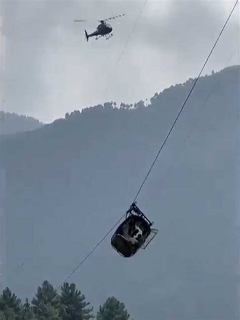 Pakistani authorities say all 8 people trapped in a cable car suspended high above a canyon have been rescued