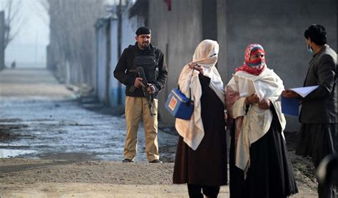 Pakistani police say gunmen kill 1 soldier and wound another in attack on polio workers