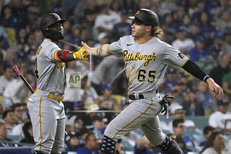 Palacios delivers a clutch double in the 9th as the Pirates rally past the Dodgers 9-7