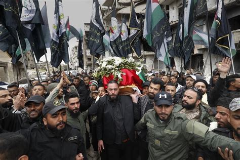 Palestinian commander killed in Syria buried in refugee camp