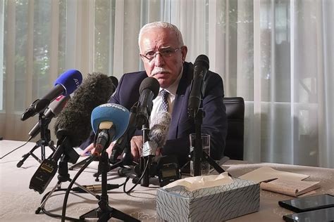Palestinian foreign minister promises cooperation with international courts on visit to The Hague