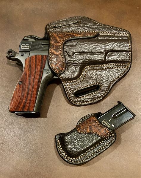 The Palmetto Leather Works Model 1 features dual loops that fasten with military grade snaps for easy on and easy off application to the belt. This outside the waistband holster offers those wanting to conceal carry a …. 