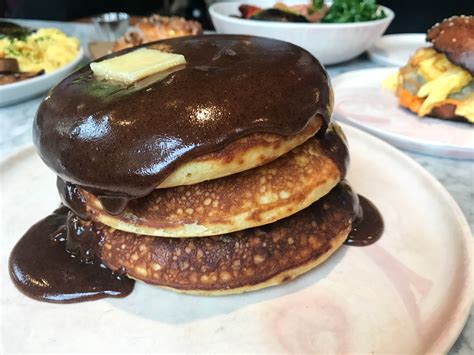Pancakes new york. Who doesn’t love a stack of fluffy, golden pancakes for breakfast? Whether you prefer them smothered in syrup, topped with fresh fruit, or served alongside crispy bacon, pancakes a... 