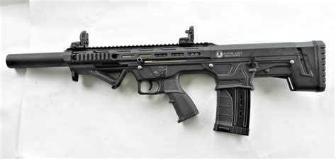 Specifications: Panzer Arms - BP-12 Bullpup Semi-Auto Tactical Shotgun - Cal. 12 ga. Barrel Length - 20". Overall Length - 30.7". Weight w/Empty Magazine - 9 lbs. Self Adjusted Gas System. Upper Receiver - 7075 Aluminum including full integral picatinny rails. Lower impact resistant polymer w/Ergonomic Grip. Bolt - Chrome Moly.. 