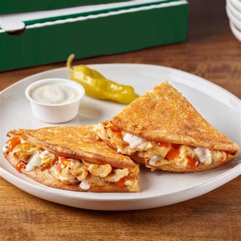 Papadias. Parmesan crusted flatbread-style sandwich made from original fresh dough and loaded with grilled chicken, onions, our signature cheese plus our 3-cheese blend, buttermilk ranch sauce, and buffalo sauce. Served with ranch dipping sauce. 