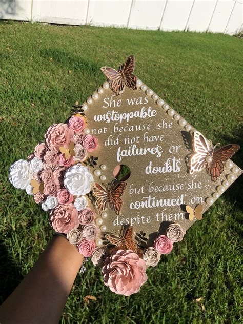 Dec 3, 2021 - "YOU DID IT! CONGRATULATIONS! Your graduation is one of your biggest accomplishments in life. Walk the stage with a stunning, unique piece and stand out from the crowd! Beautiful hand rolled paper flowers, shimmery butterflies, chic pearly border and sparkly rhinestones to finish it off. Add any quote or message you'd …. 