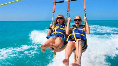 Parachute key west. Go parasailing above the emerald waters of Key West for a thrilling 1-hour tour that provides sweeping views of Florida’s southernmost city and its surroundings. Head out in a 12-passenger state-of-the-art parasailing boat out to the ocean, then your guide secures you into a double or triple-person parasailing device for a ride that gently ... 