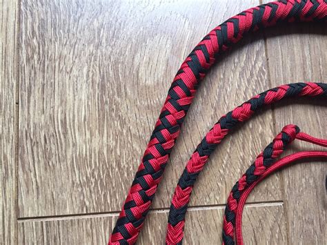 Paracord whip. The first step is to simply daisy chain all but 3 feet of rope on the very end! First, make a loop about 1.5 to 2 feet from the end (pic 1). You'll use this to finish to handle later. Then, pinch the long end of the cord close to the loop and push it through the first loop (pic 2). Picture 3 is the starting knot tightened. 