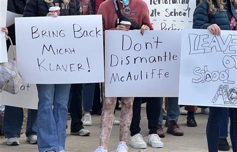 Parents protest staffing decisions at McAuliffe International School