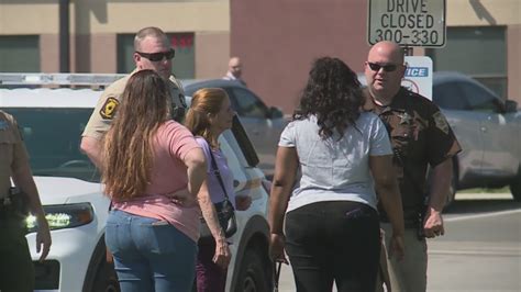 Parents spend frantic hours outside school after hoax threats